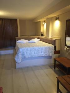 Krevet ili kreveti u jedinici u okviru objekta Olympic Hotel