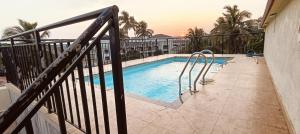 a swimming pool on the balcony of a house at Joe Height Apartment in Baga