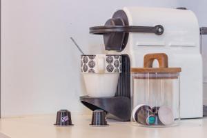 a coffee maker sitting on a counter with a cup at Appartement moderne et élégant Michel Torrent 2 in Perpignan