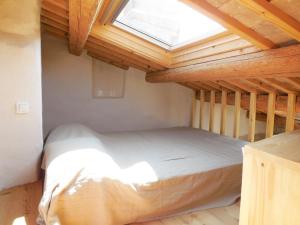 a bed in a room with a window at Stone House Apartments in Brtonigla