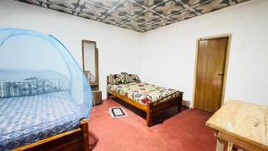 Postel nebo postele na pokoji v ubytování Sigiri Elephants Path Hostel