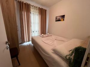 Ένα ή περισσότερα κρεβάτια σε δωμάτιο στο Cattleya Apartment