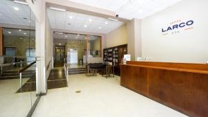 a lobby of a library with a large sign on the wall at Suites Larco 656 Miraflores Lima in Lima