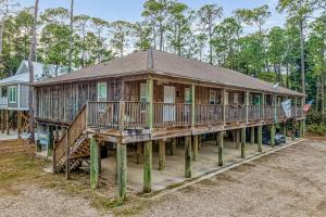 a large wooden house on stilts at O'Hara Haven in Dauphin Island