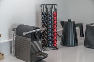 a bunch of wine bottles in a rack on a counter at Waterview apartments with ultra fast wifi close to Excel and O2, corporates and contractors welcome in London