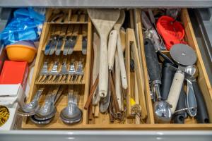 a drawer filled with lots of different types of tools at Waterview apartments with ultra fast wifi close to Excel and O2, corporates and contractors welcome in London