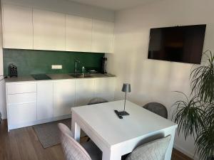 Kuchyň nebo kuchyňský kout v ubytování M&M-Apartment + 11 fotografií