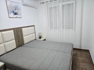 a bedroom with a bed and a window at Villa Sunshine in Bar