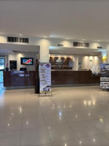 a shopping mall with a sign in the middle at Hotel María Eugenia Tuxtla Gutiérrez in Tuxtla Gutiérrez