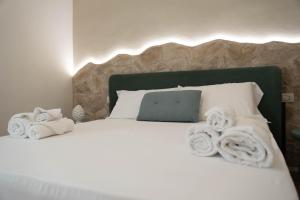 Postel nebo postele na pokoji v ubytování Lues Rooms