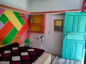 Ein Bett oder Betten in einem Zimmer der Unterkunft Moon Hotel Tungnath