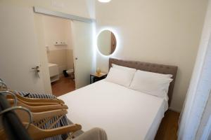 Postel nebo postele na pokoji v ubytování Lues Rooms