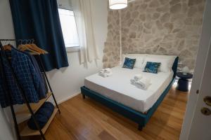 Postel nebo postele na pokoji v ubytování Lues Rooms