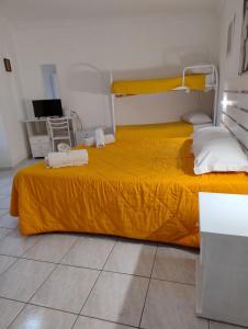 Letto o letti in una camera di Al Dammuso Diffuso in Centro