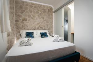 Postel nebo postele na pokoji v ubytování Lues Rooms