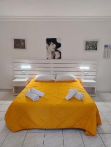 Letto o letti in una camera di Al Dammuso Diffuso in Centro