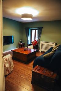 a living room with a couch and a coffee table at Número 8 a Traditional Basque Village Homestead in Laguardia