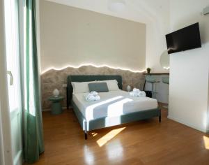 Postel nebo postele na pokoji v ubytování Lues Rooms