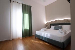 Postel nebo postele na pokoji v ubytování Lues Rooms