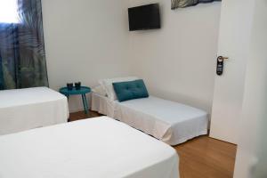 Postel nebo postele na pokoji v ubytování Lues Rooms