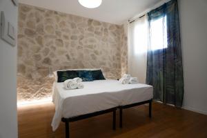 Postel nebo postele na pokoji v ubytování Lues Rooms