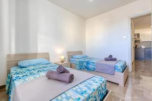 Llit o llits en una habitació de Apartment in Marsaskala