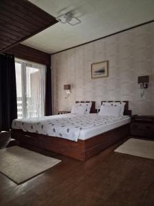 Postel nebo postele na pokoji v ubytování Pensiunea Terra Nova