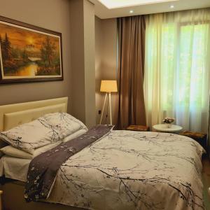 Postel nebo postele na pokoji v ubytování Driti Central Hotel