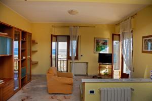a living room with a view of the ocean at 40 mt dal mare Casa Mare la Pergola in Santa Caterina Dello Ionio Marina