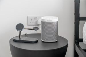 a small speaker sitting on top of a table at Waterview apartments with ultra fast wifi close to Excel and O2, corporates and contractors welcome in London