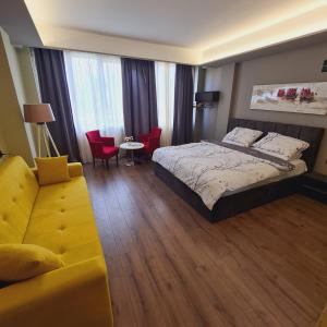 Postel nebo postele na pokoji v ubytování Driti Central Hotel