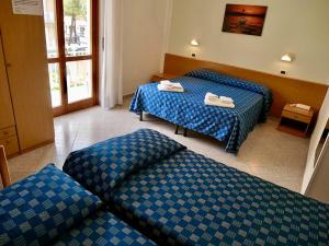 Ένα ή περισσότερα κρεβάτια σε δωμάτιο στο Hotel Jole