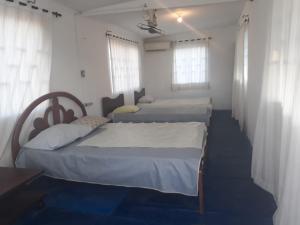 Voodi või voodid majutusasutuse Cabaña Puerto Colombia CARNAVAL BARRANQUILLA 2025 toas