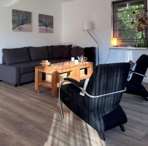 Posezení v ubytování Vakantiehuis Bos en Hei Veluwe + 62 fotografií
