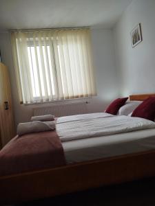 Postel nebo postele na pokoji v ubytování Guest House Kovalik