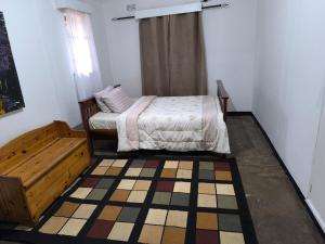 Postel nebo postele na pokoji v ubytování Serene Home