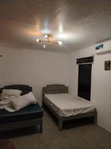 Postel nebo postele na pokoji v ubytování Pamarayeg Room
