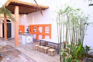 a dining room with a table and some plants at Second house in Ấp Khánh Phước (1)