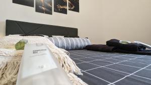a bedroom with a bed with a bag on the floor at Room with free parking 15 minutes walk from Arena in Verona +8 photos