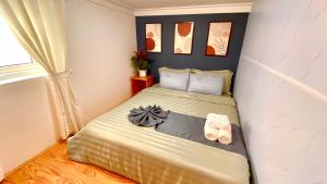 Postel nebo postele na pokoji v ubytování Lê Mùi Hotel - Apartment
