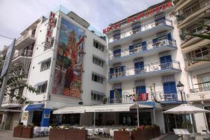 a building with a mural on the side of it at Platjador in Sitges