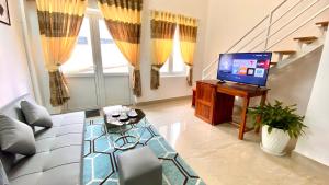 TV a/nebo společenská místnost v ubytování Lê Mùi Hotel - Apartment