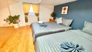 Postel nebo postele na pokoji v ubytování Lê Mùi Hotel - Apartment