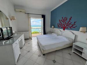 Postel nebo postele na pokoji v ubytování Sunbay Park Hotel
