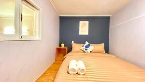 Postel nebo postele na pokoji v ubytování Lê Mùi Hotel - Apartment