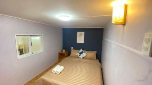 Postel nebo postele na pokoji v ubytování Lê Mùi Hotel - Apartment