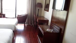 Postel nebo postele na pokoji v ubytování FT Hotel