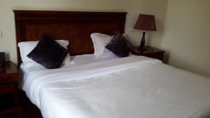 Postel nebo postele na pokoji v ubytování FT Hotel