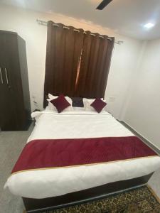 Postel nebo postele na pokoji v ubytování Hotel Ram Bhawan
