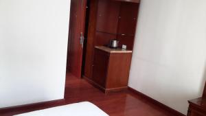 Postel nebo postele na pokoji v ubytování FT Hotel